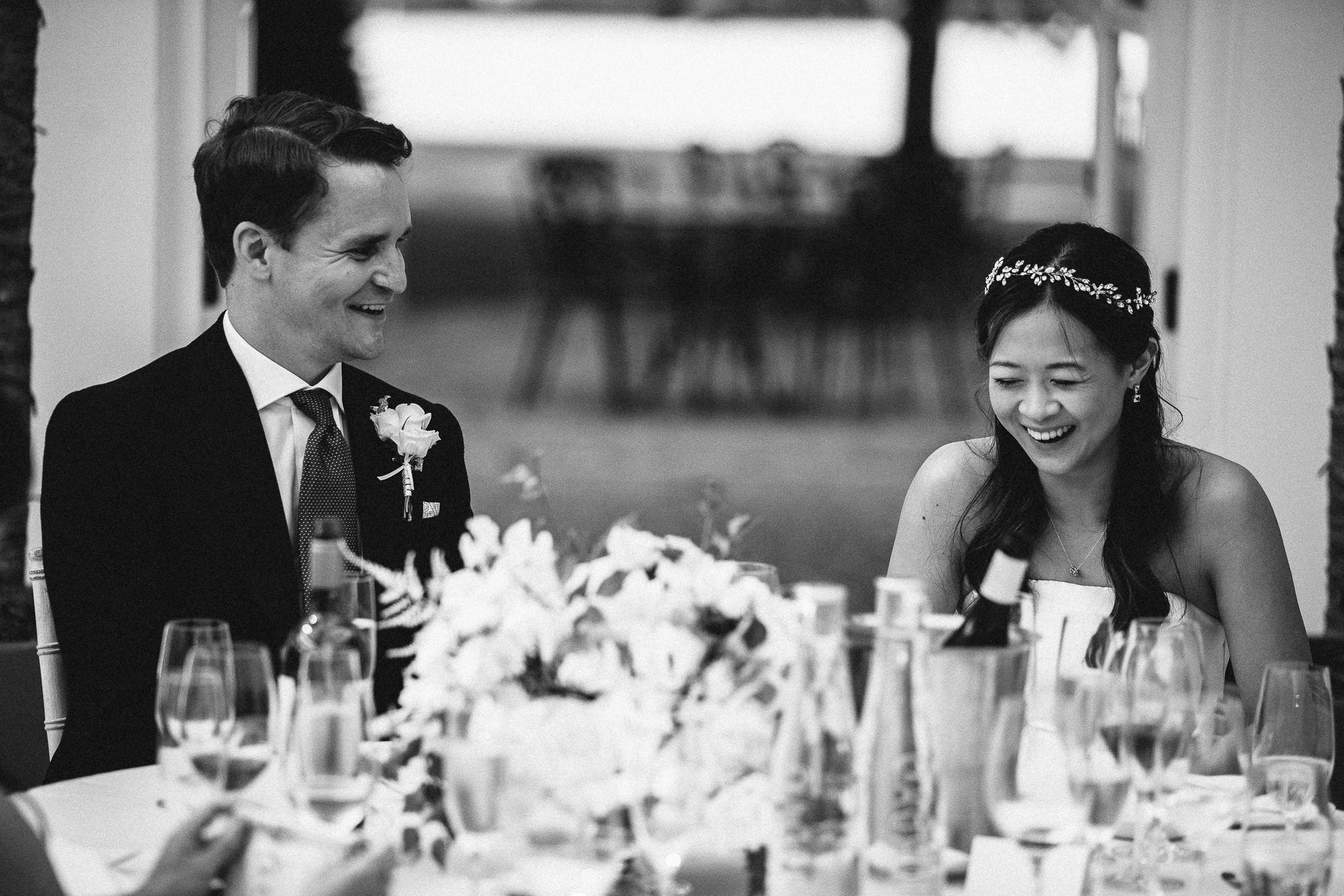  Bride and Groom laughing during the speeches 