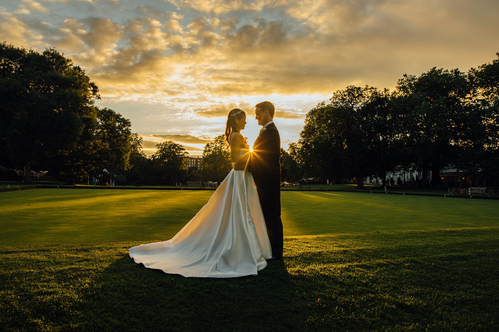  Bride and Groom at the Hurlingham Club as the sun sets in the west 