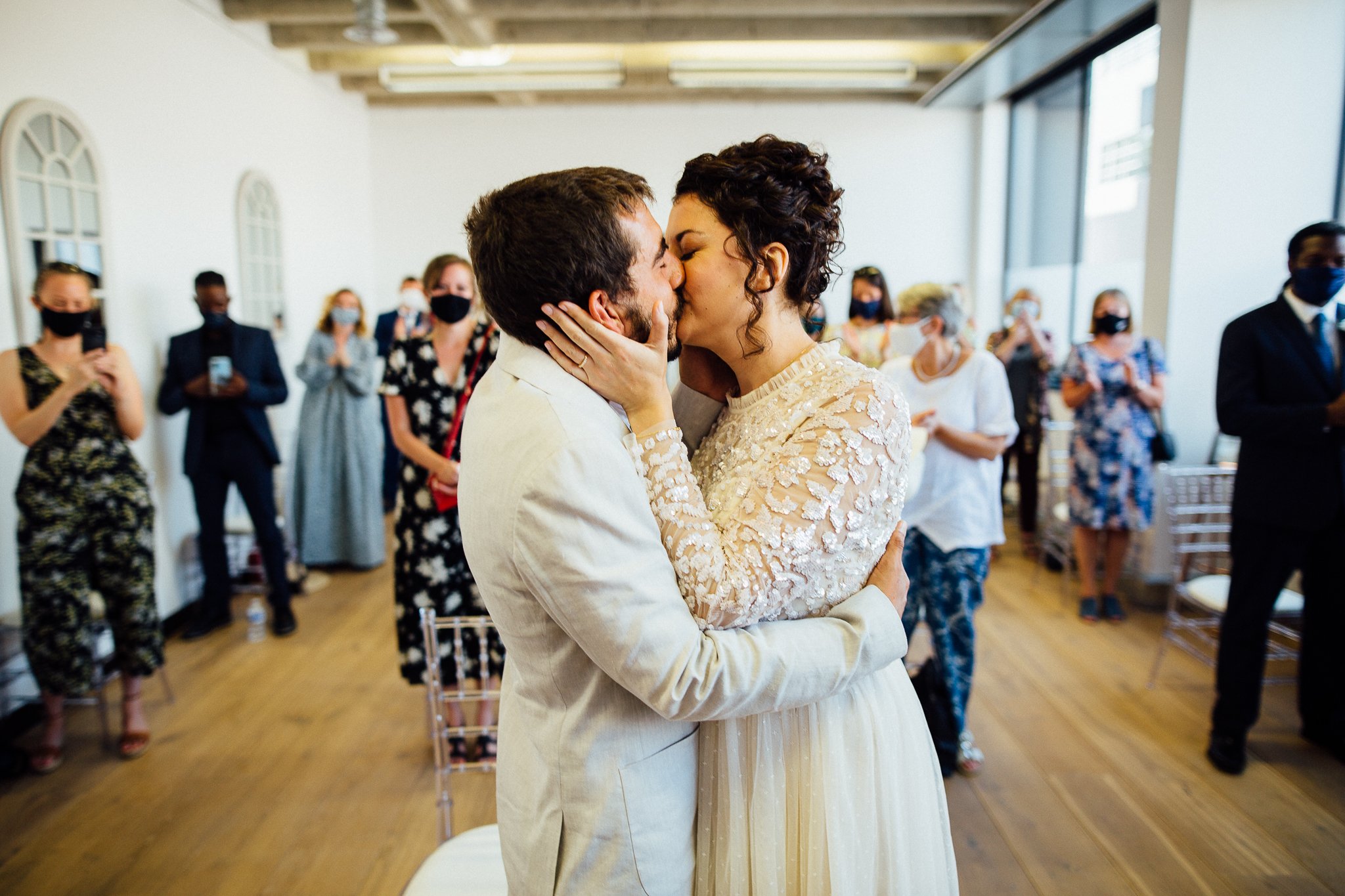  Bride and Groom kiss after getting married at Hammersmith Register Office. 