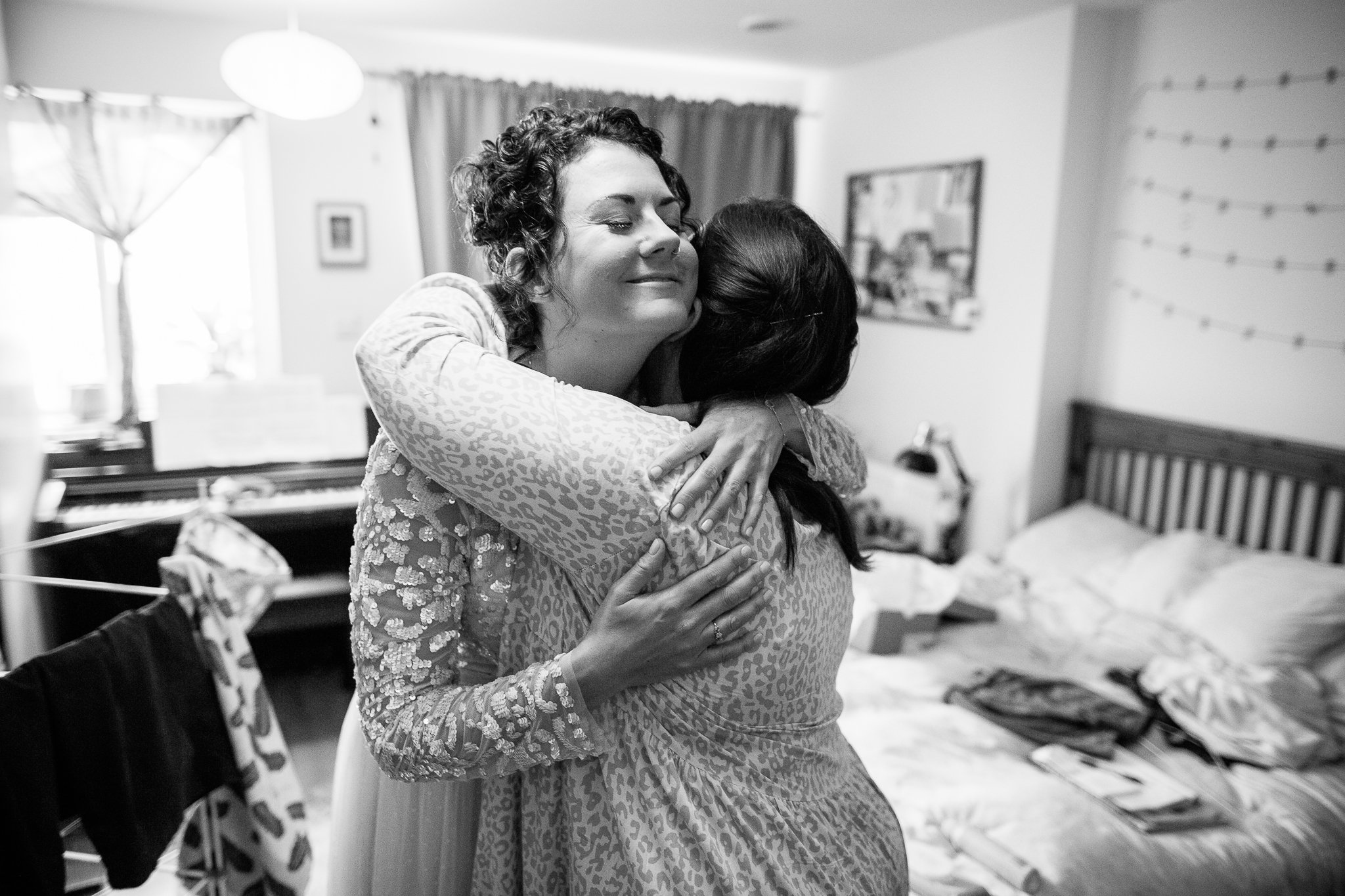  Bride hugging her Bridesmaid 