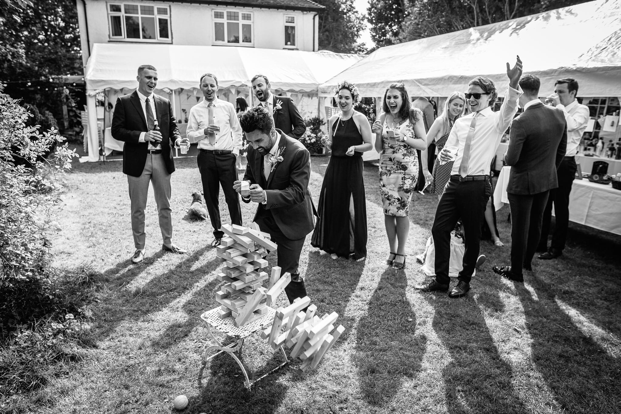  Groom playing jenga and failing 