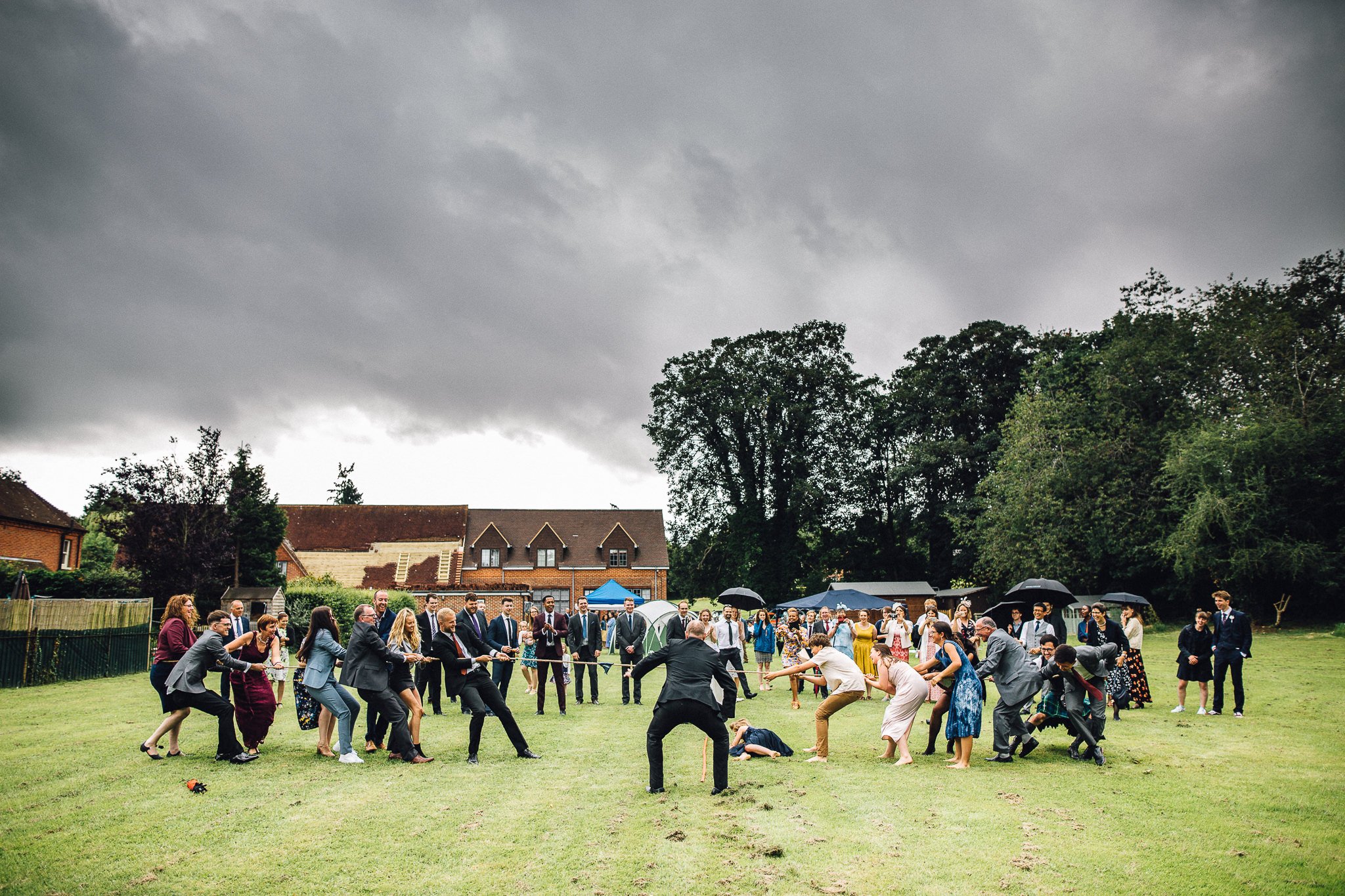  Wedding Guests play tug of war at Harpsden Village Hall 