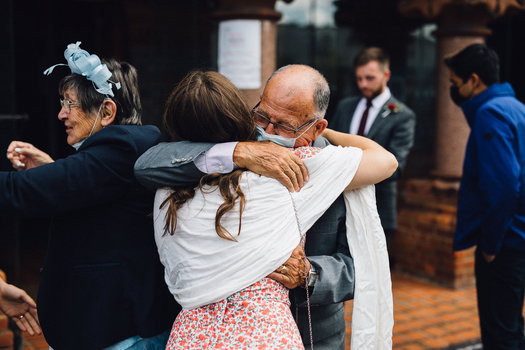  Wedding guest hugging outside Wycliffe Baptist Church in Reading 