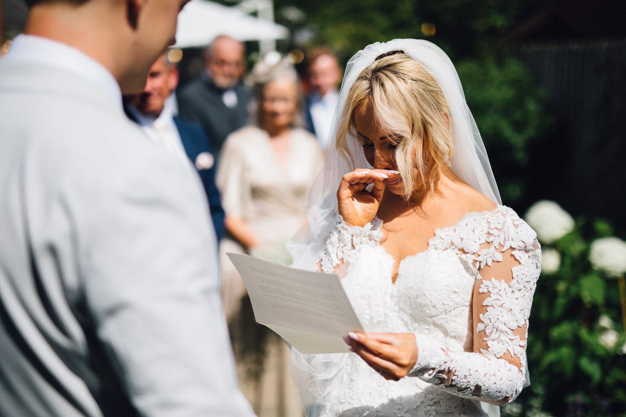  Bride gets emotional as she reads her vows during the wedding ceremony 