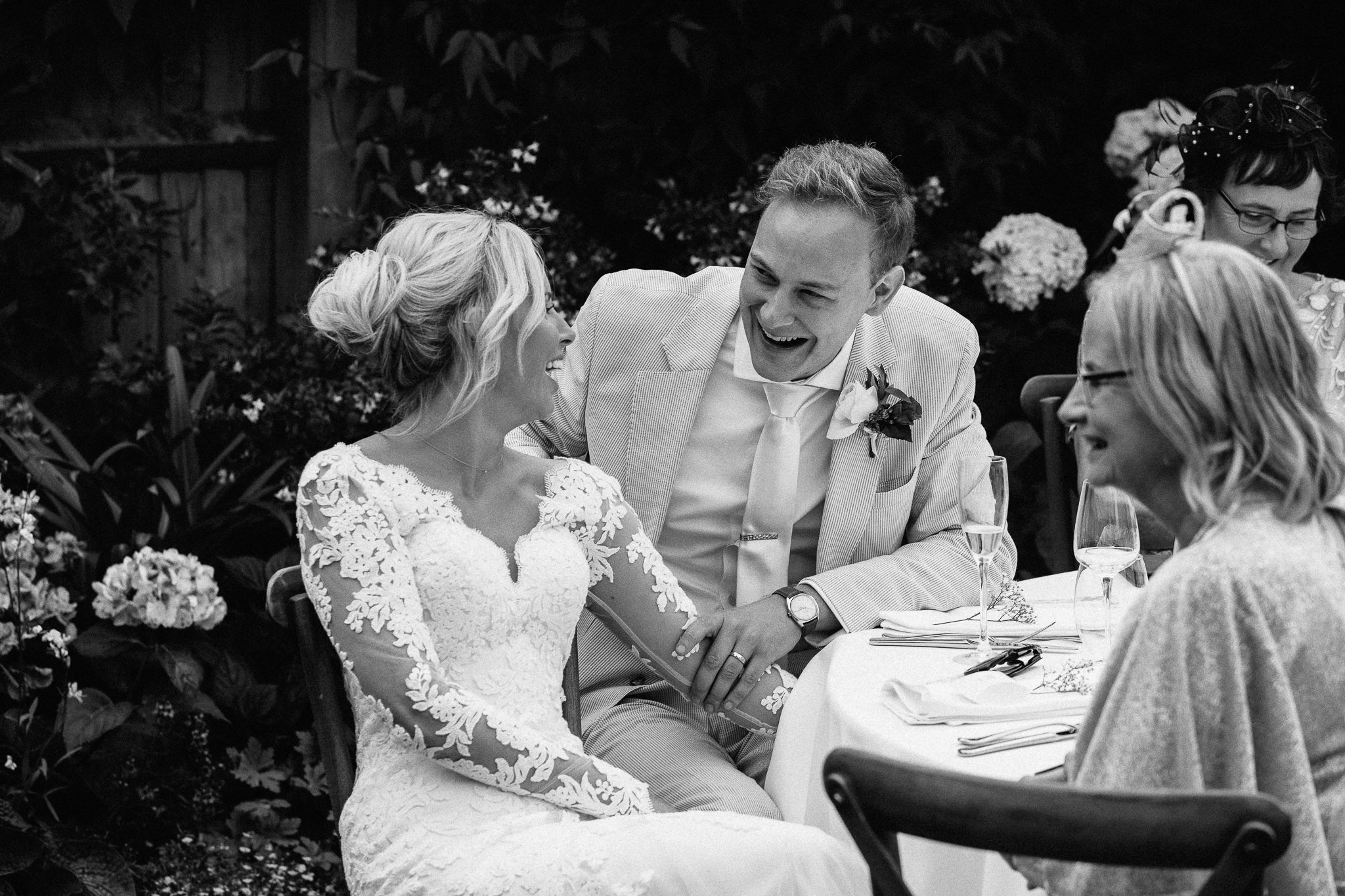  Bride and Groom laughing during the wedding speeches 