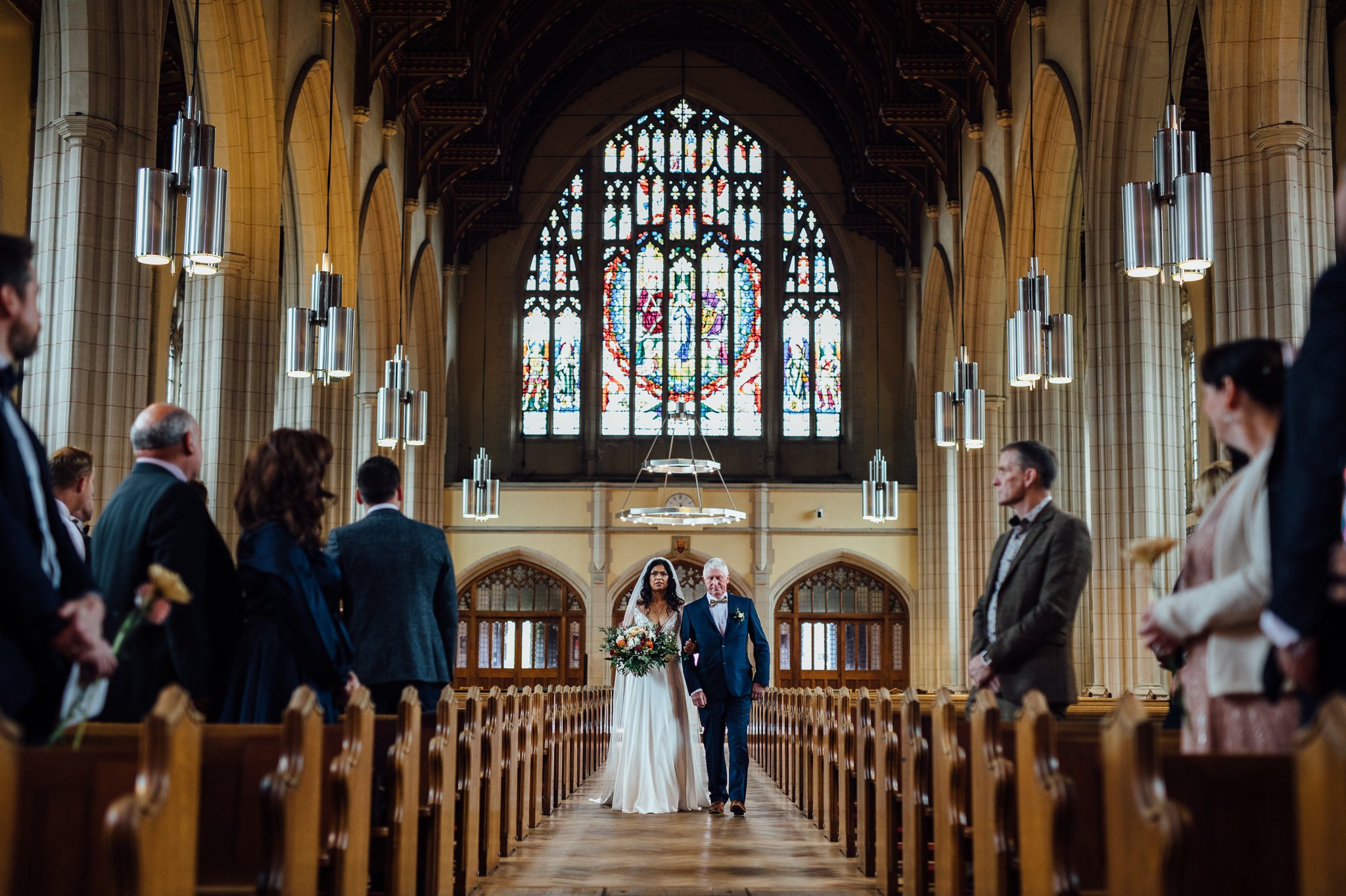 Bride is walked down the aisle at Ealing Abbey 
