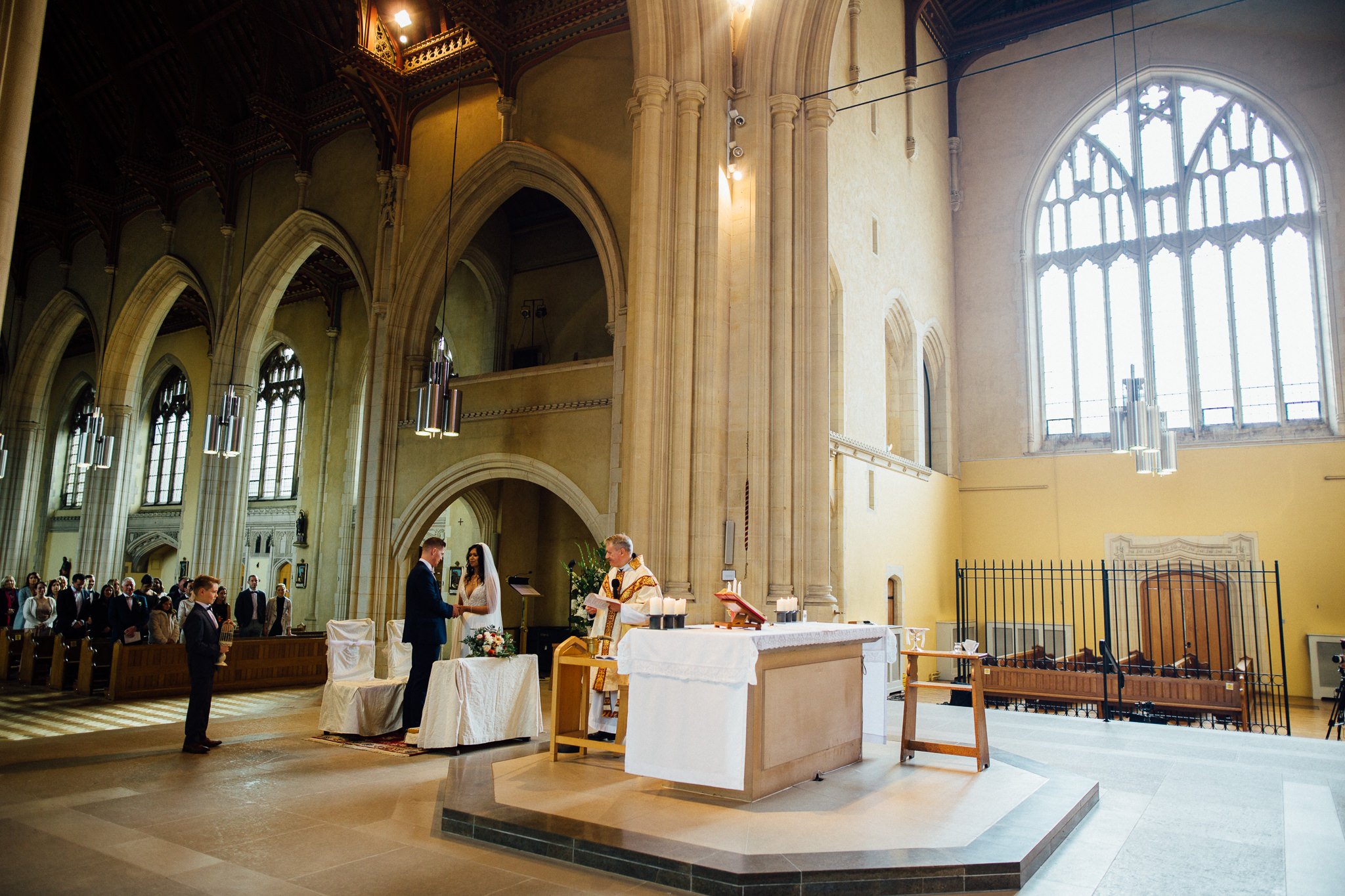  Bride and Groom during the ceremony at Ealing Abbey 