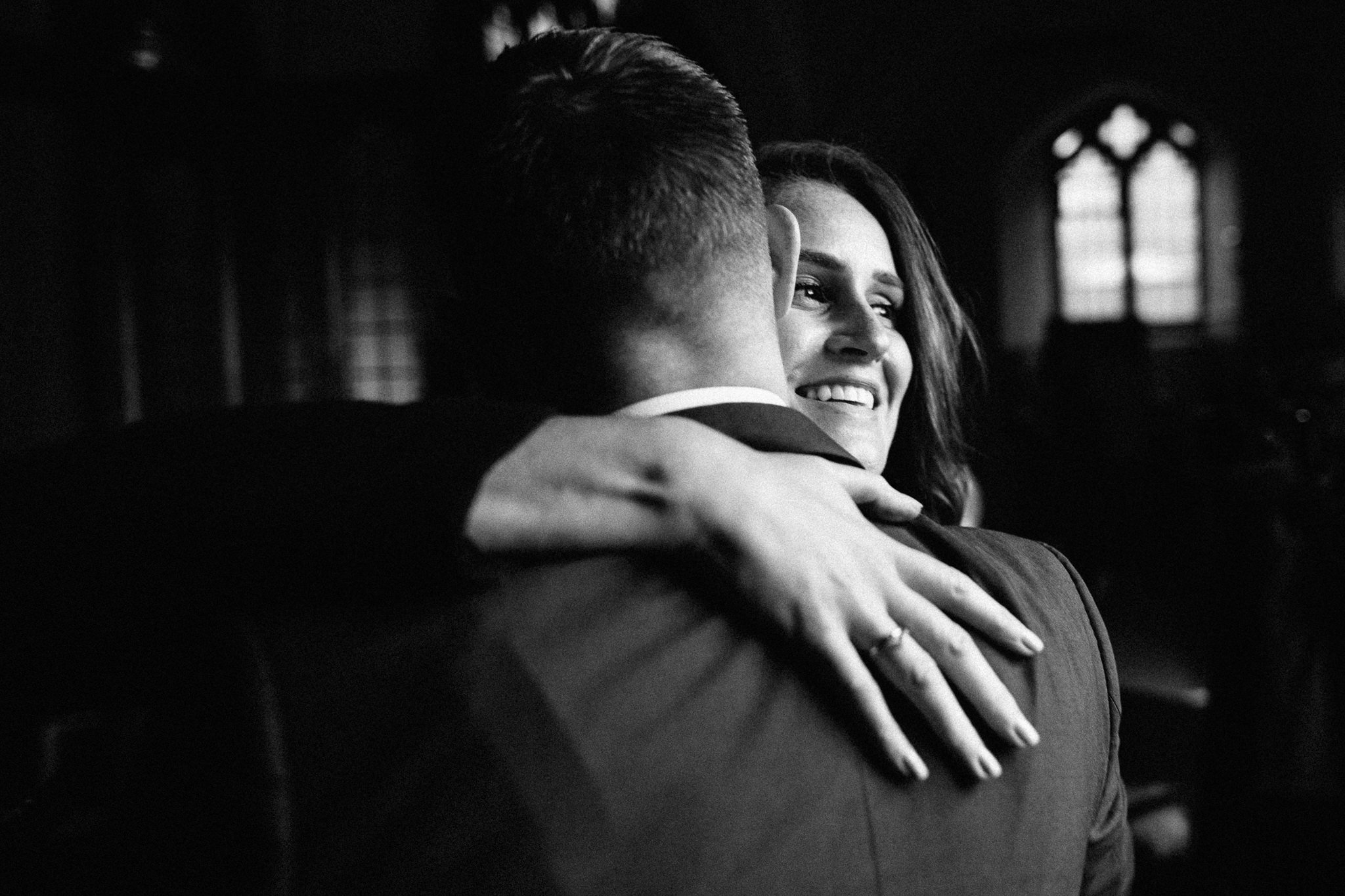  A wedding guest hugs the Groom 