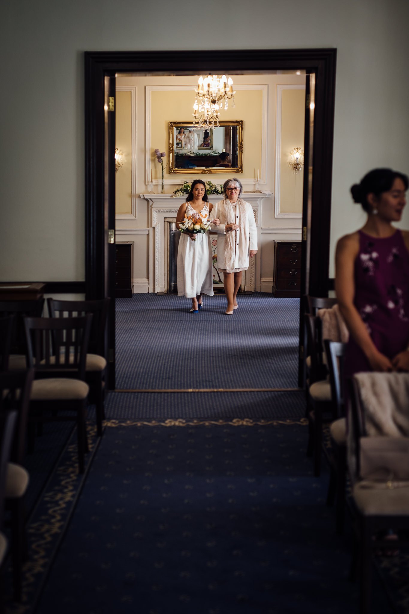  Bride about to walk into the ceremony room at The Mansion in Leatherhead 
