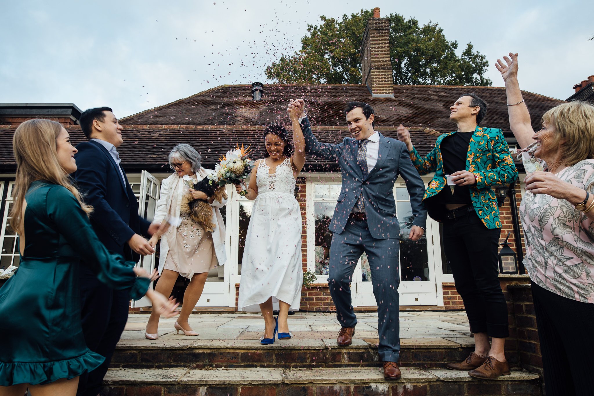  Bride and Groom have confetti thrown at them after  the ceremony 