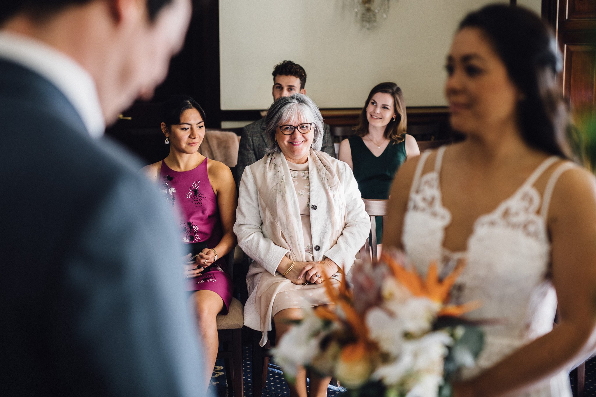  Mother of the Bride smiling during the wedding ceremony at The Mansion 