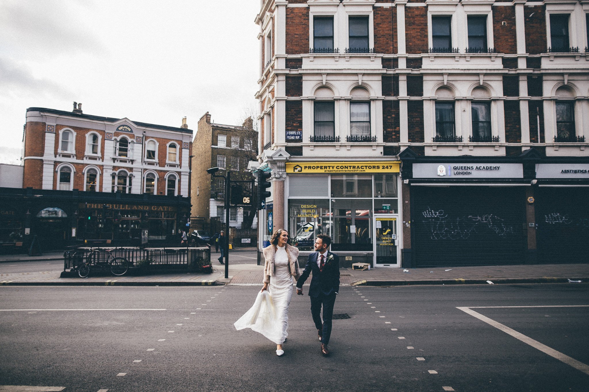  Bride and Groom crossing the road outside the Bull and Gate 