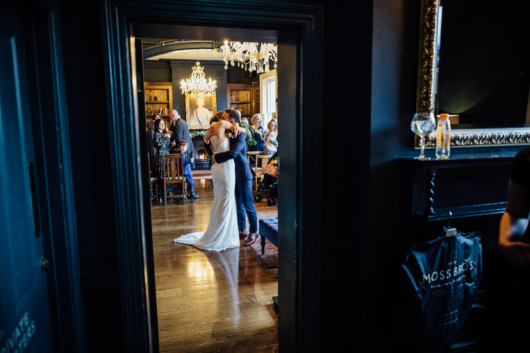  Bride and Groom hug after they are married at the Bull and Gate pub 