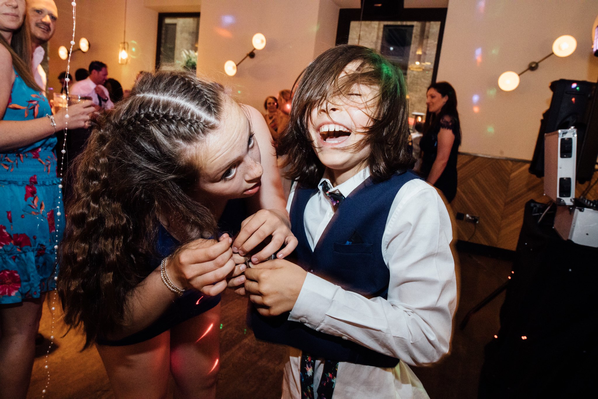  Young wedding guests laughing 