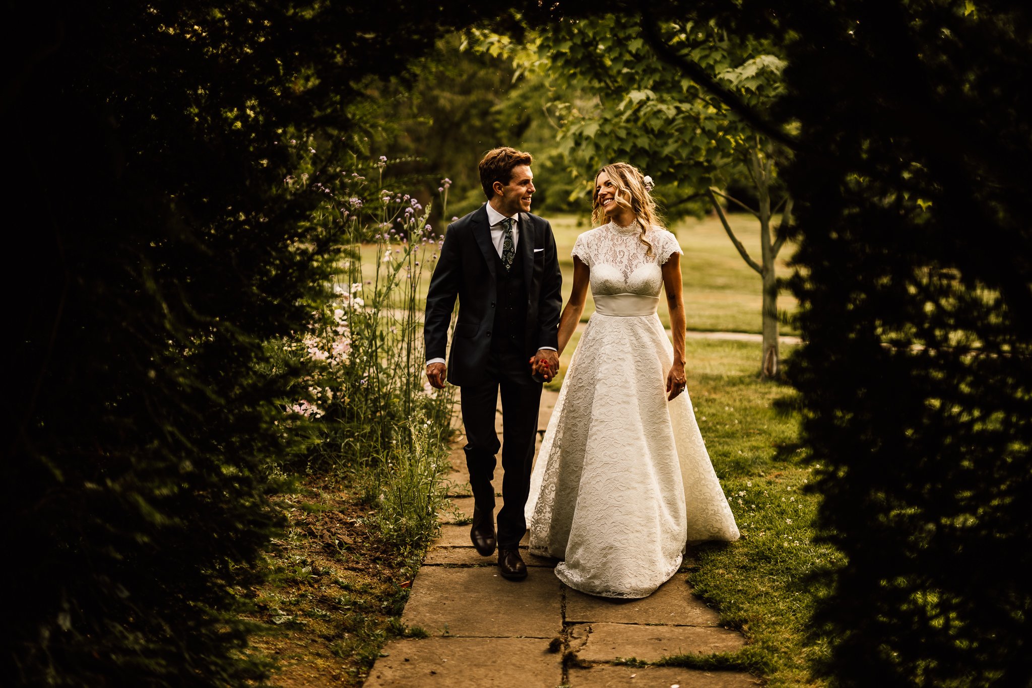  Bride and Groom look at each other during the golden hour at Arley House and Gardens 