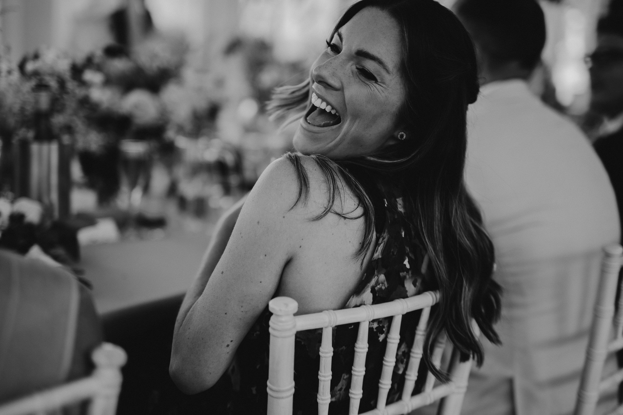  The sister of the Bride laughing during the wedding speeches 