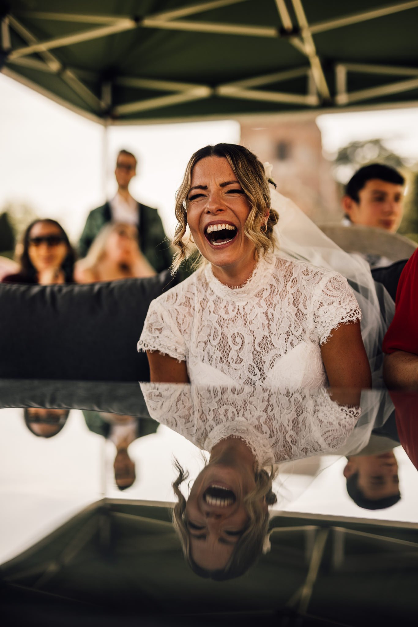  Bride laughing during the speeches 