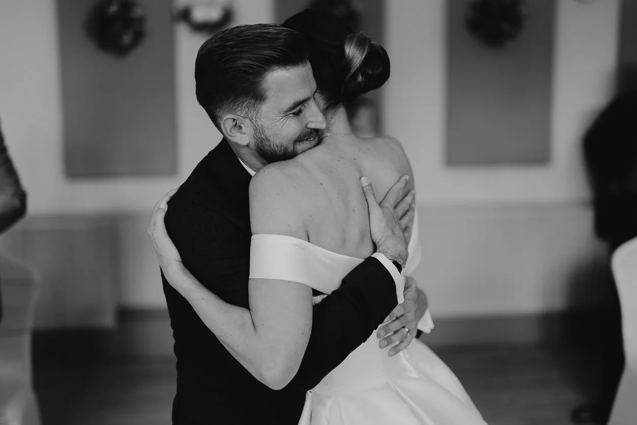 Bride and Groom hugging during the ceremony