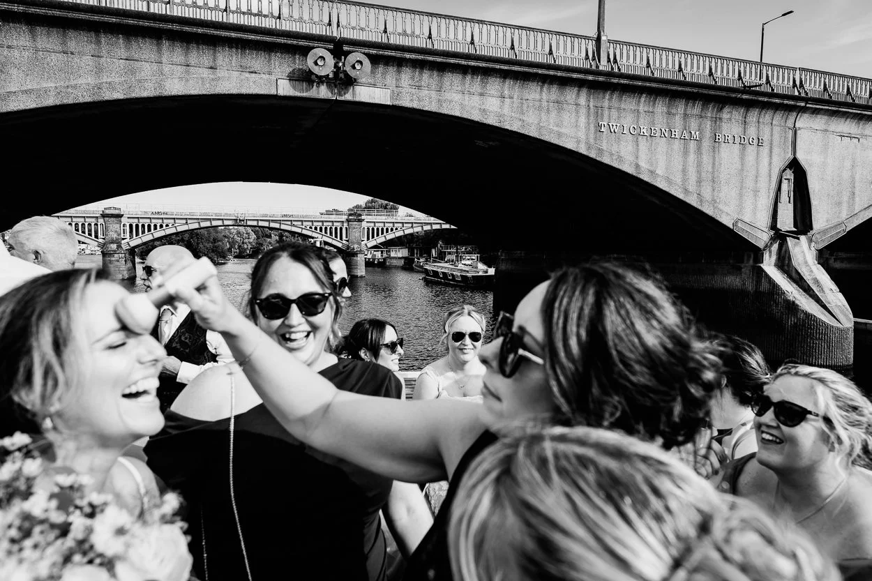 Bride has her makeup adjusted by her friends