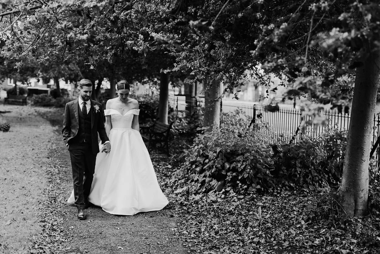 Bride and Groom walk through Warwick Dene gardens