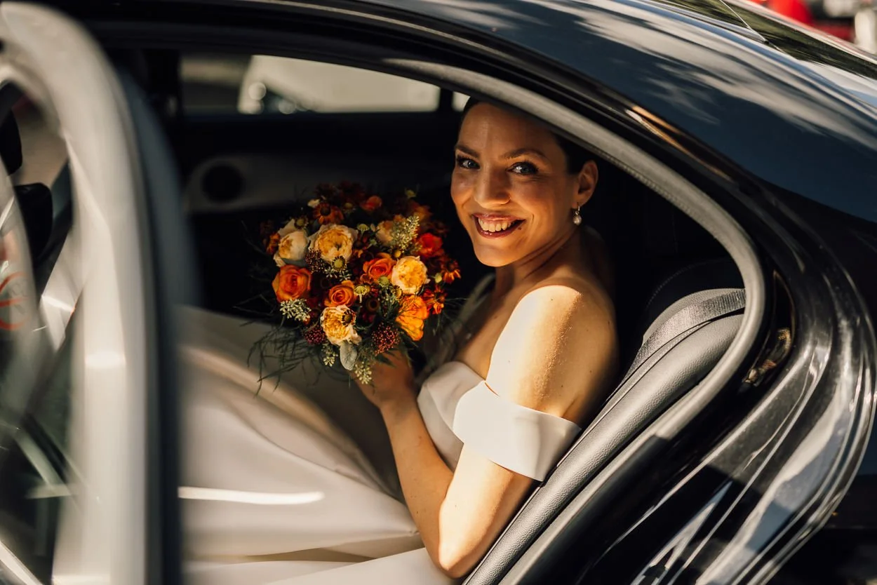 Bride arrives in her wedding car at the venue