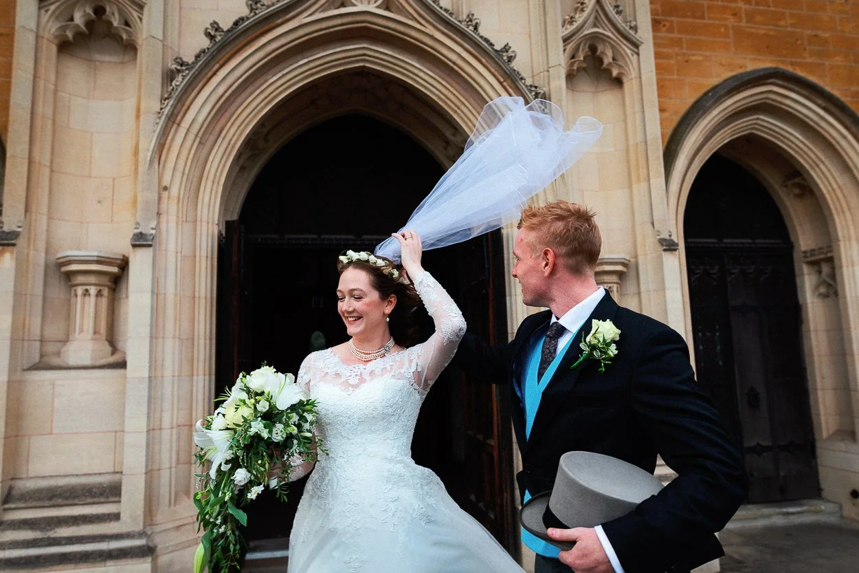 The brides veil gets caught in the wind