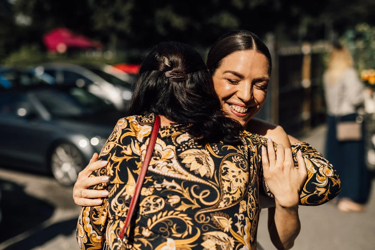 Bride hugs guest at the Bretham Club