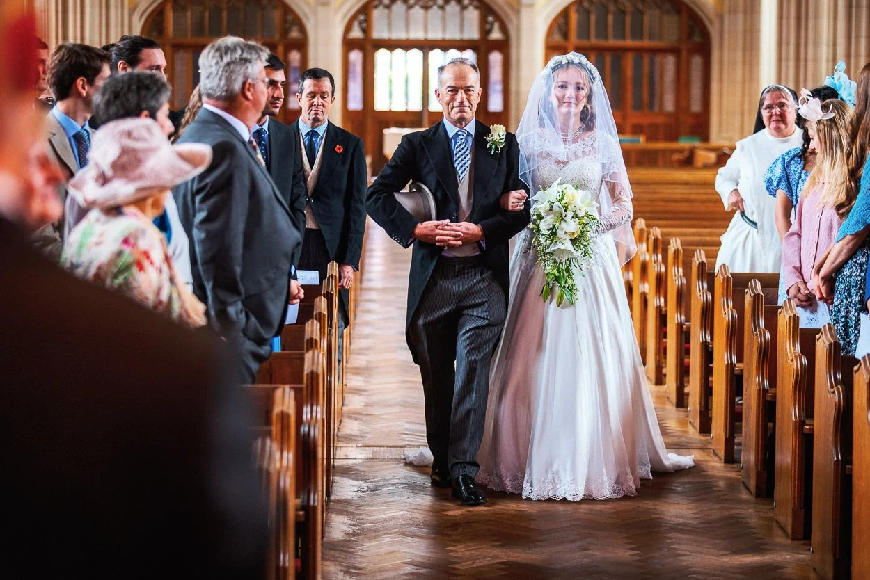 The bride and her father walking down the aisle