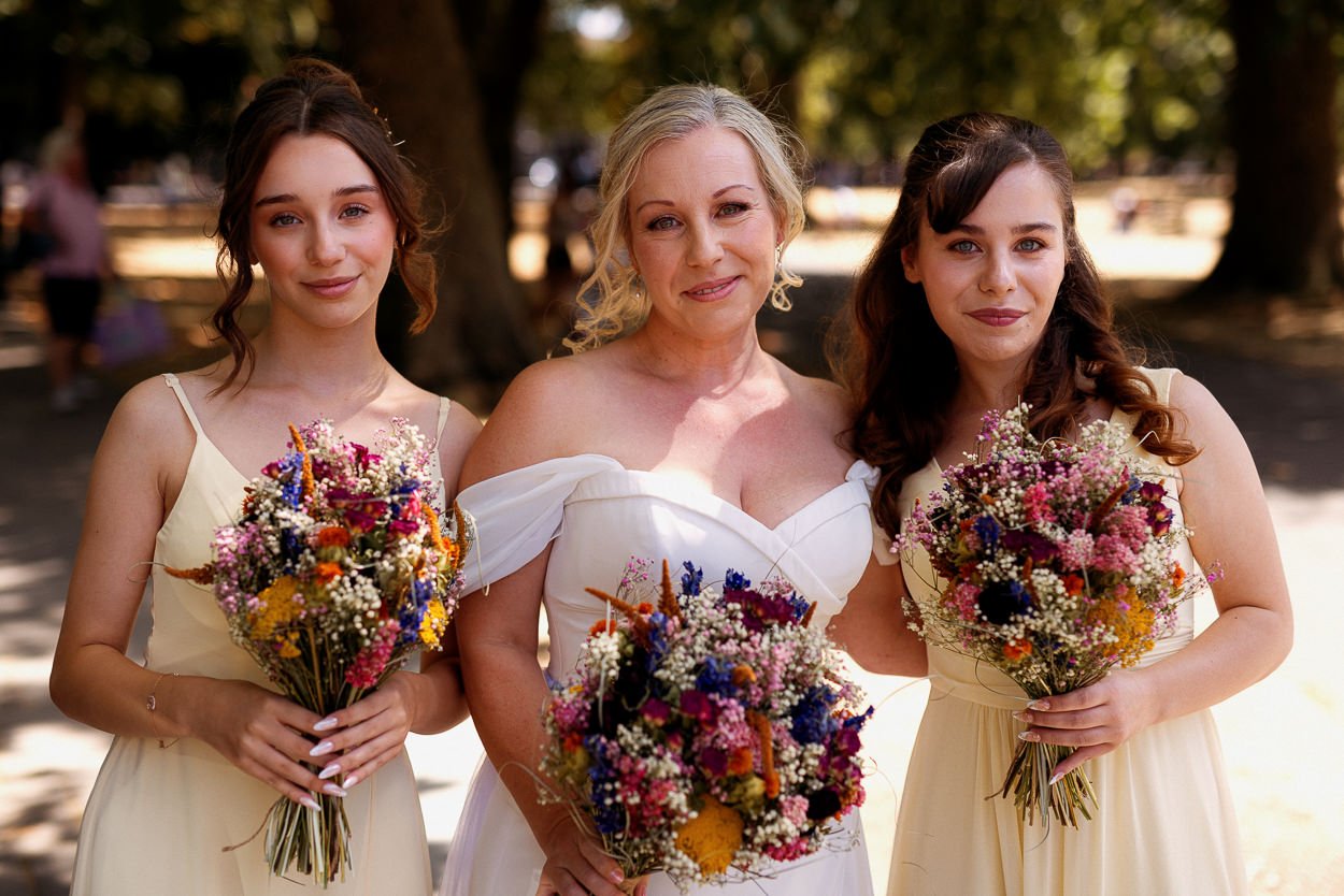 Bride and bridesmaids in the park