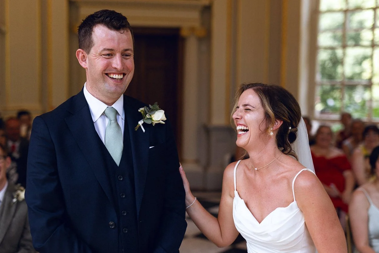 Bride and groom laughing during the ceremony