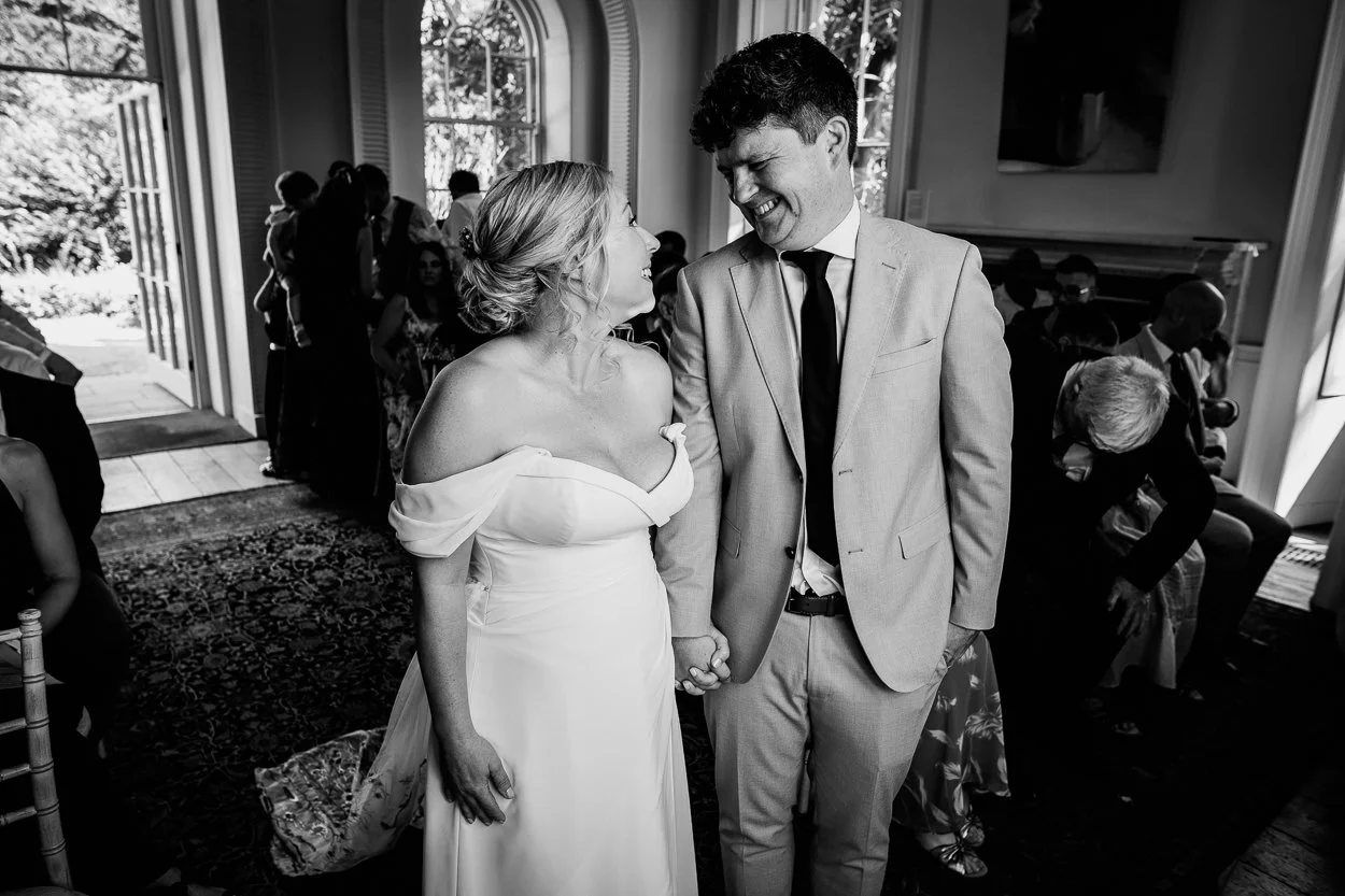 Couple smiling at each other during the ceremony