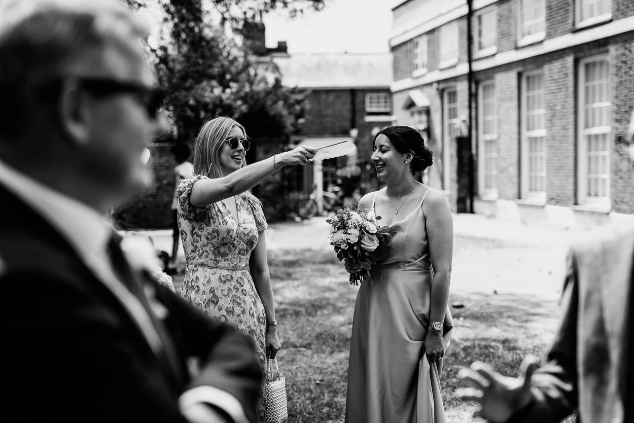 A guest getting fanned in the heat