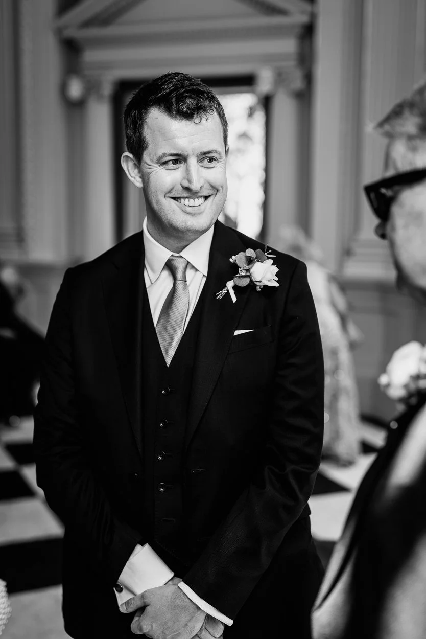 The groom smiling