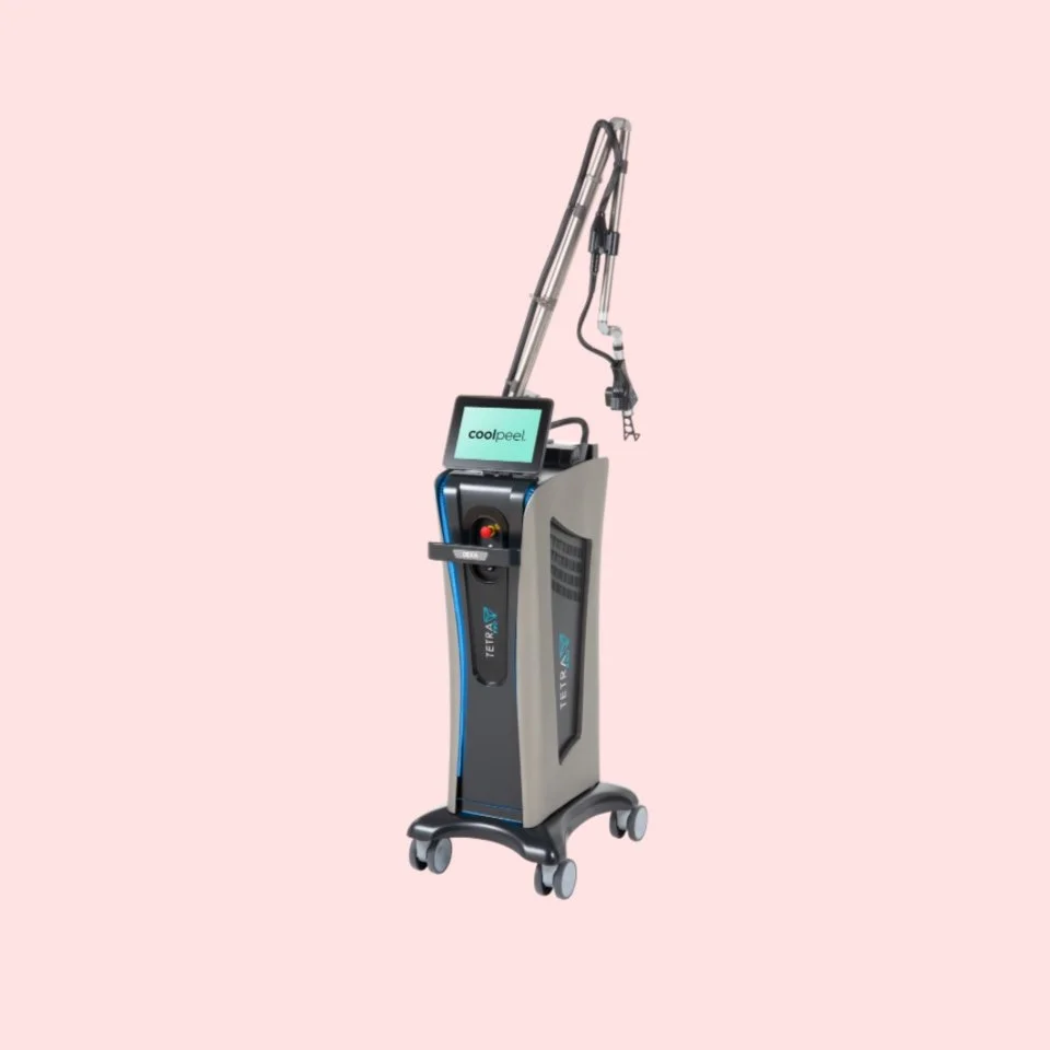 Medical laser device with a screen, labeled "cool peel," on a wheeled base, against a light pink background.