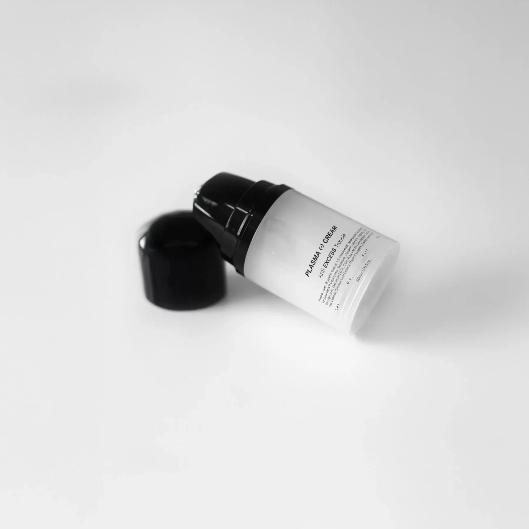 An uncapped bottle of Medipair's Plasma Cream that shows the pump dispenser