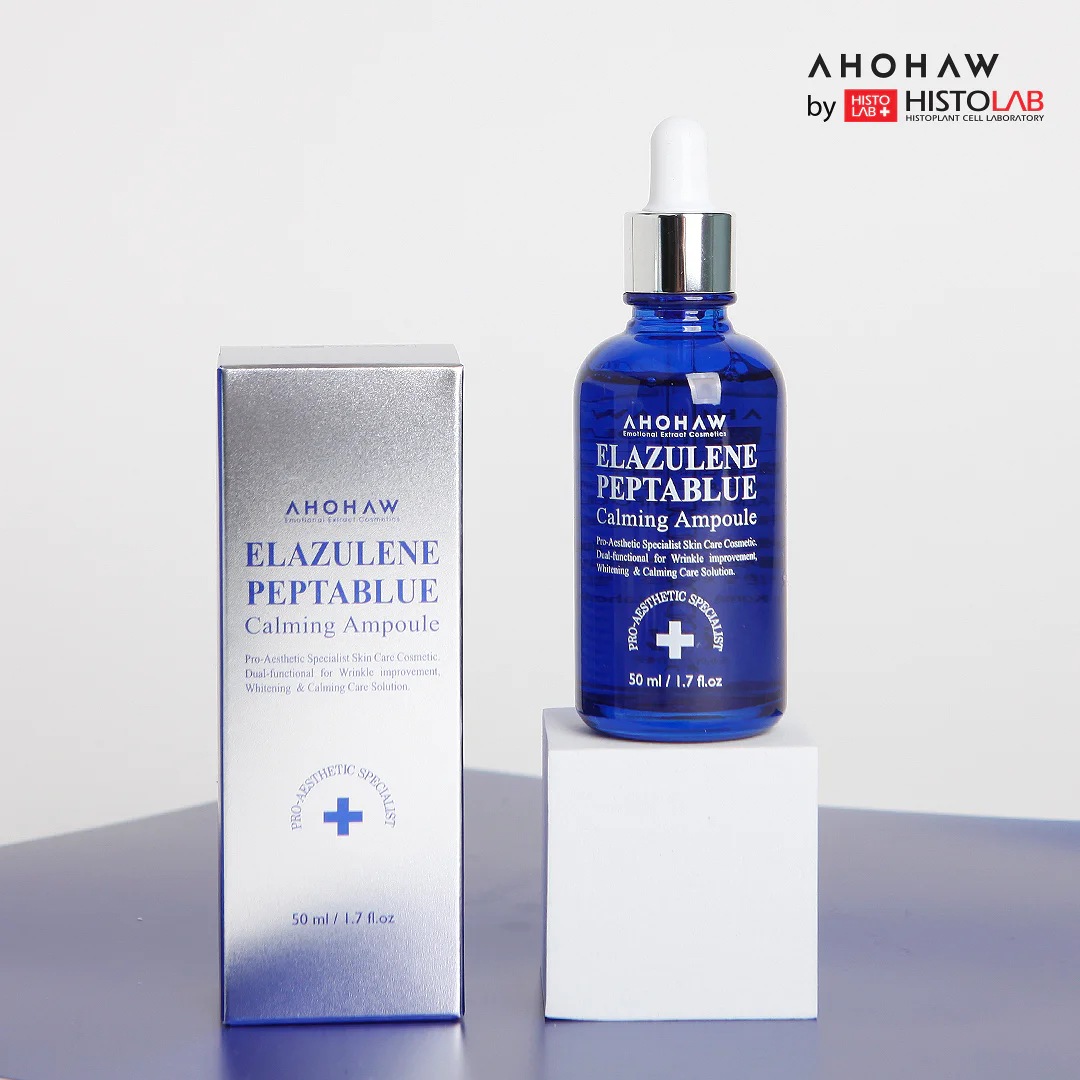 Ahohaw Elazulene Calming Ampoule bottle standing beside its original retail packaging box