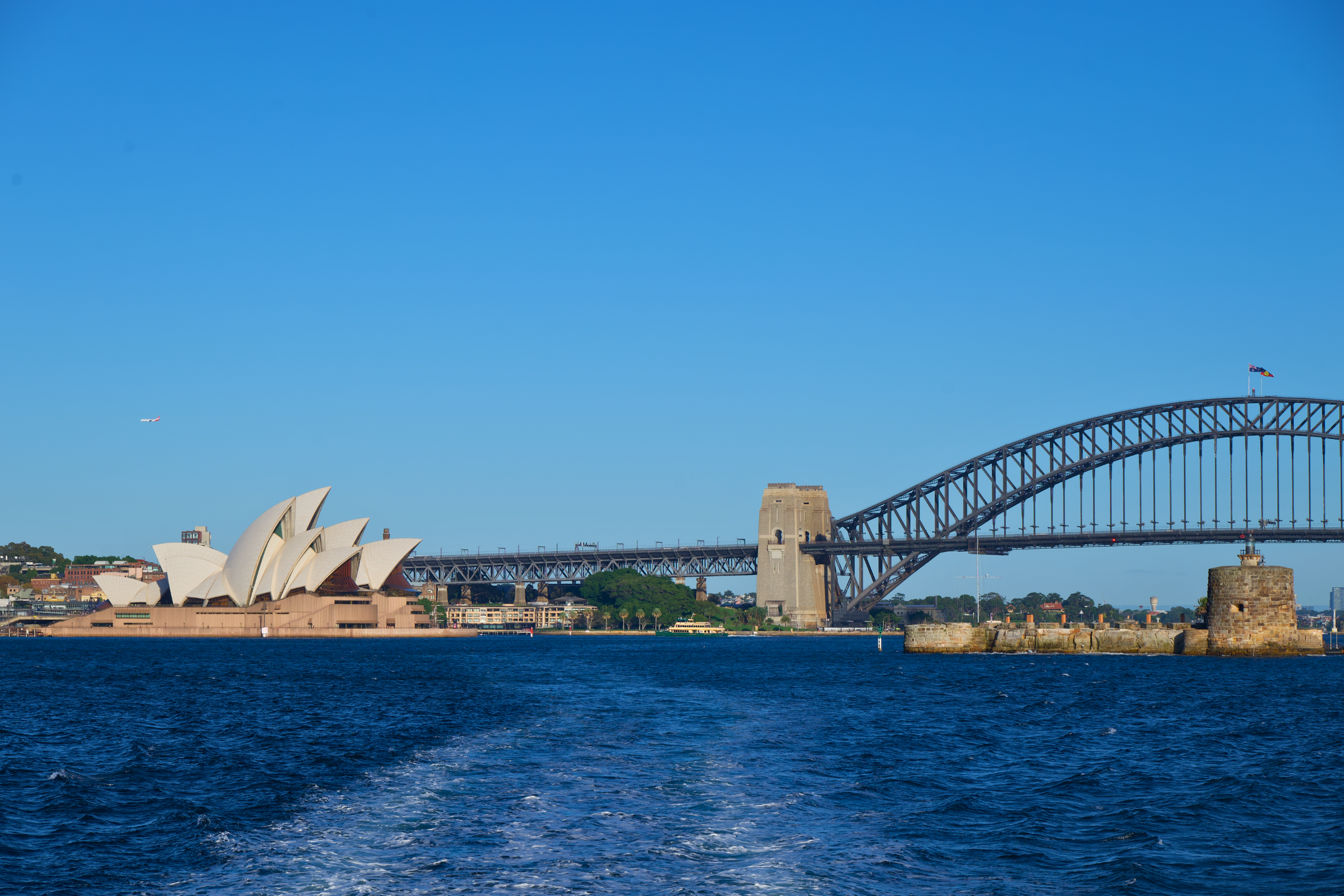 Sydney Opera House and Sydney Bridge view from the ferry in the harbor