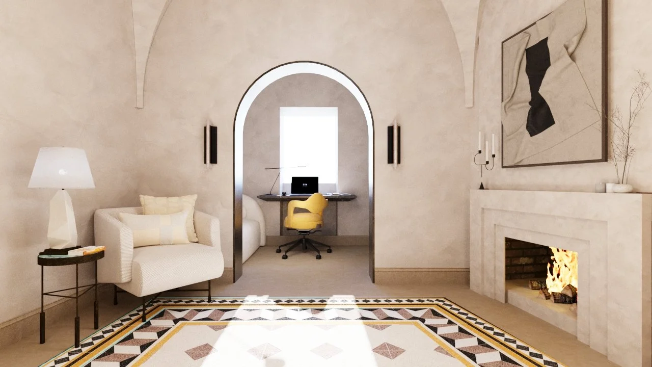 Living room with cream walls, a fireplace with a fire, modern artwork above the fireplace, a white armchair with a pillow, a side table with a lamp, and a workspace area with a yellow office chair and a desk with a laptop in the background.