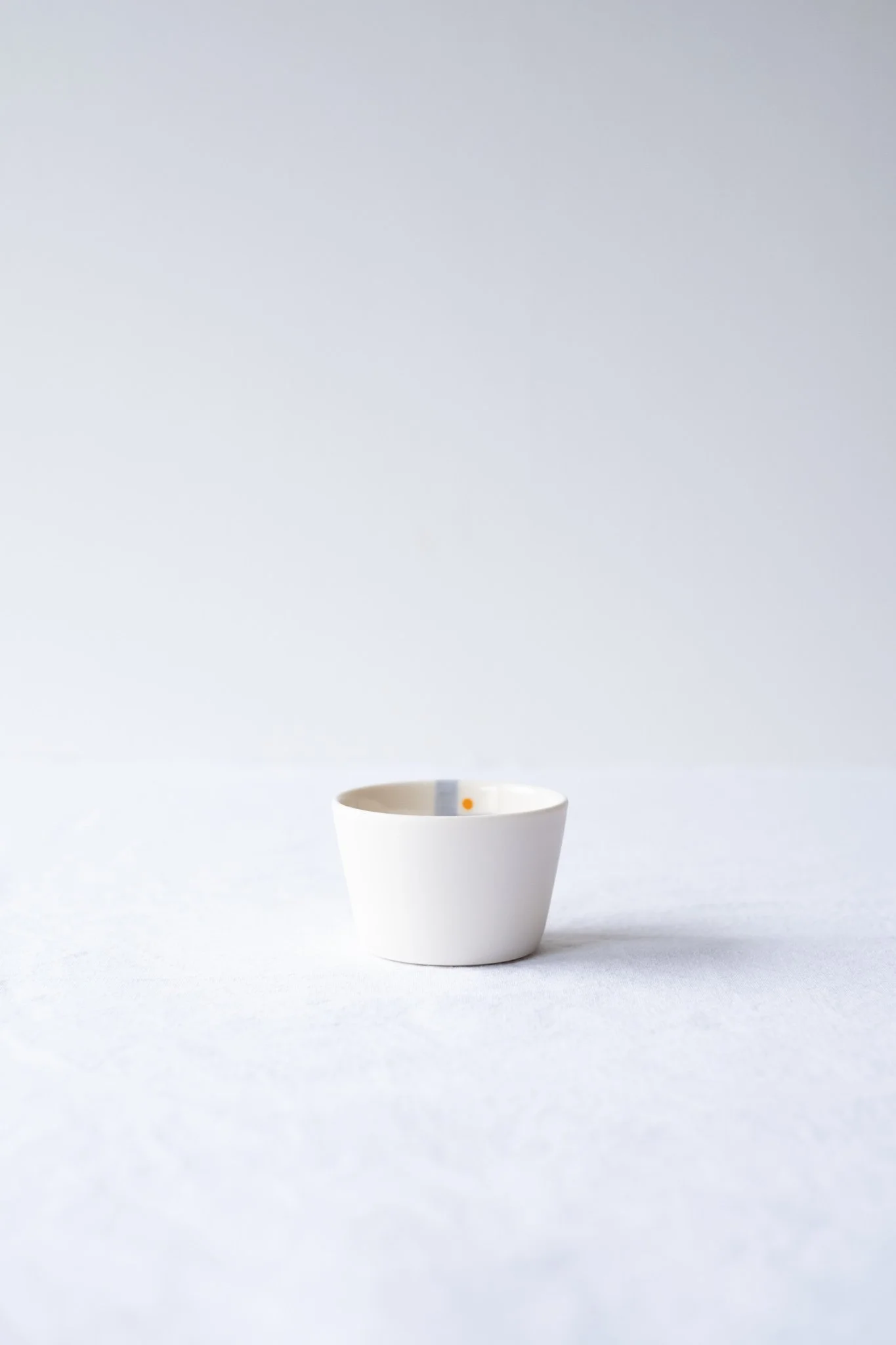 Small porcelain cup hand-painted No. 1