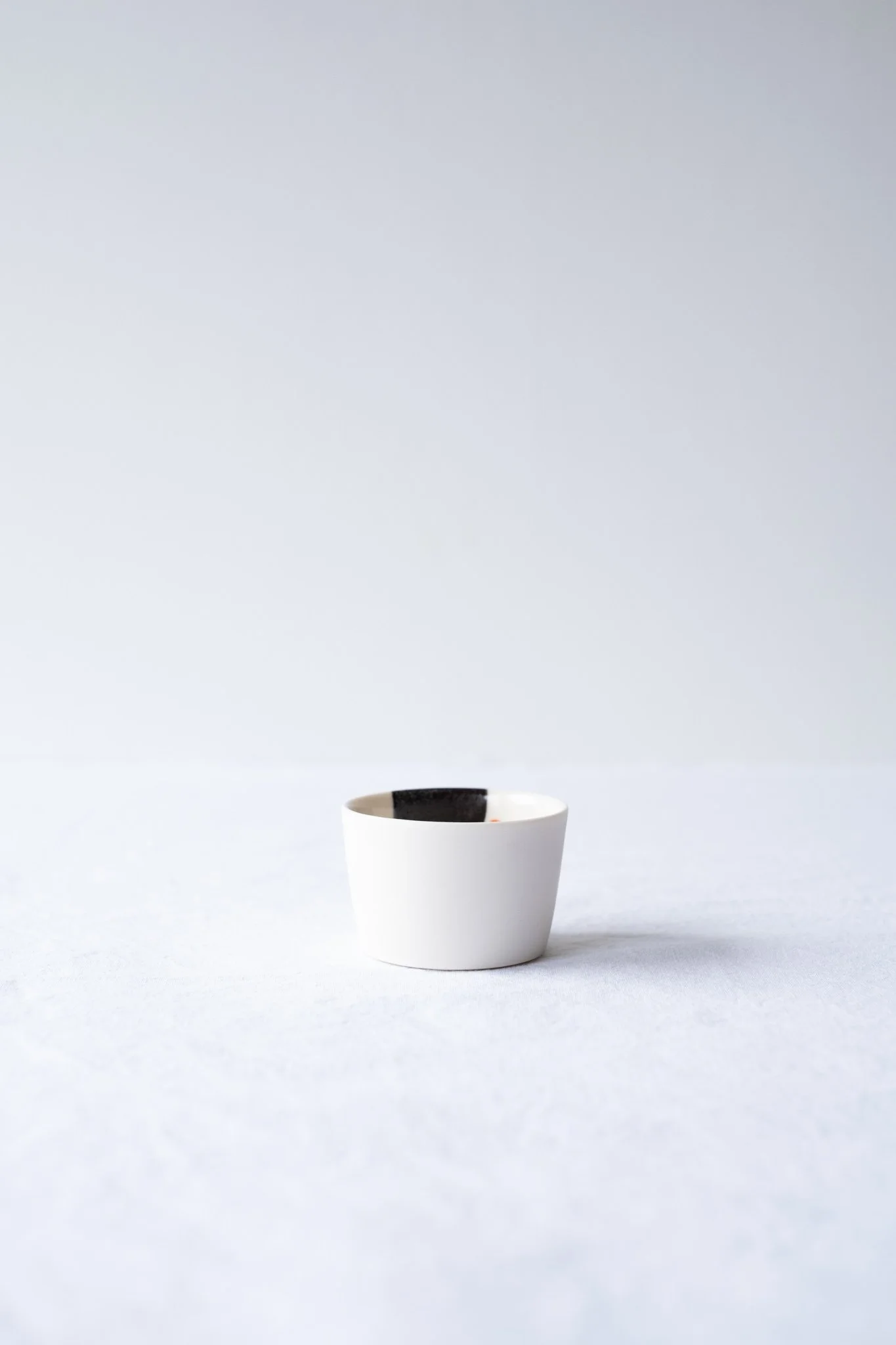 Small porcelain cup hand-painted No. 3