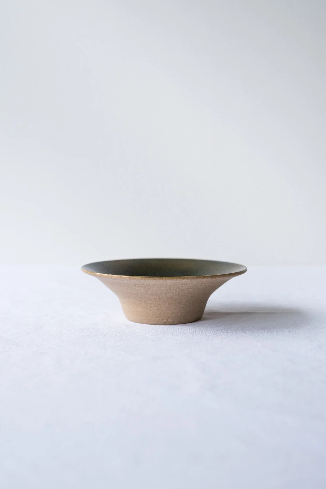 Medium flower bowl in toffee sand with deep emerald green