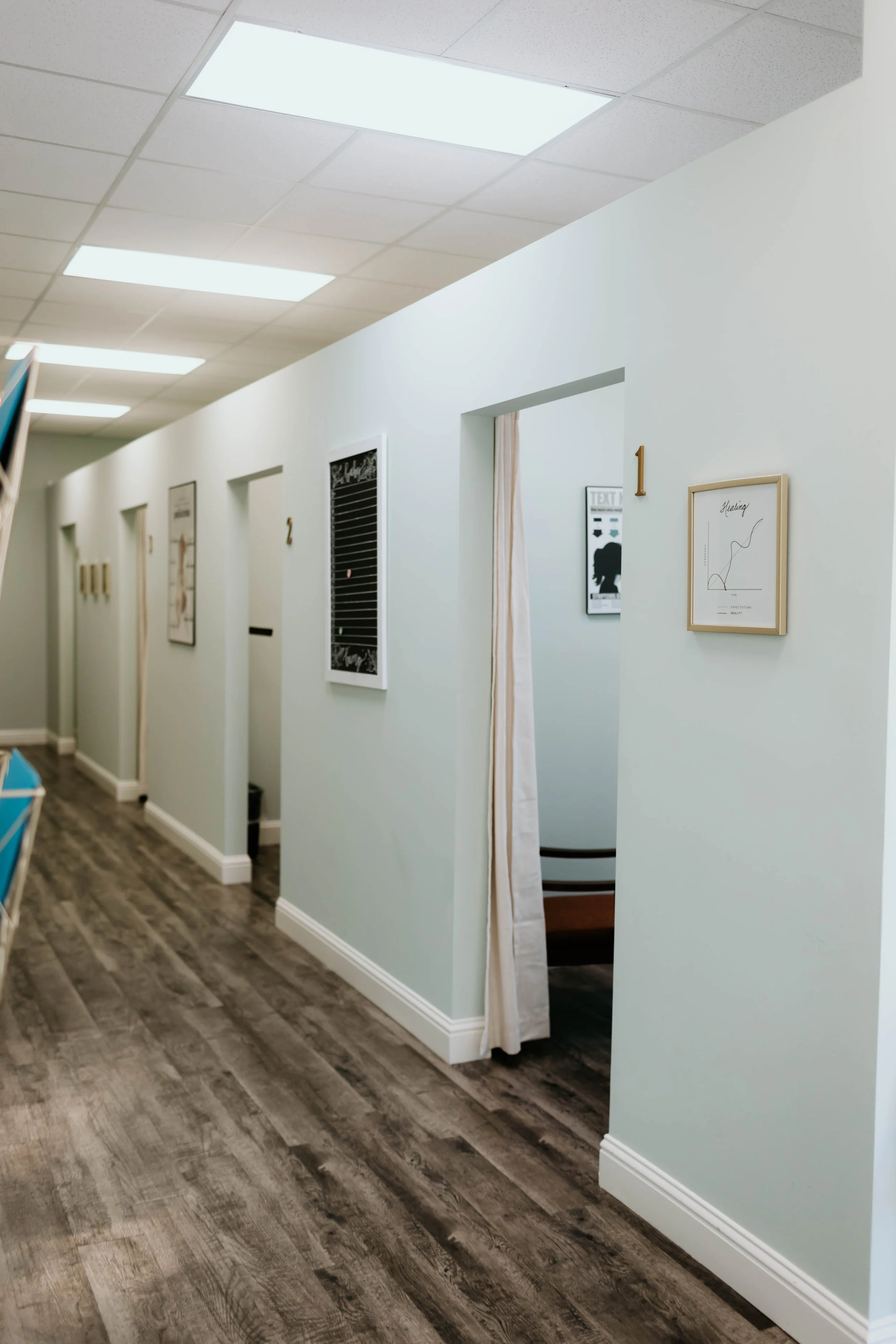 Hallway leading to chiropractic adjustment rooms at Thrive Family Chiropractic in Montgomery AL