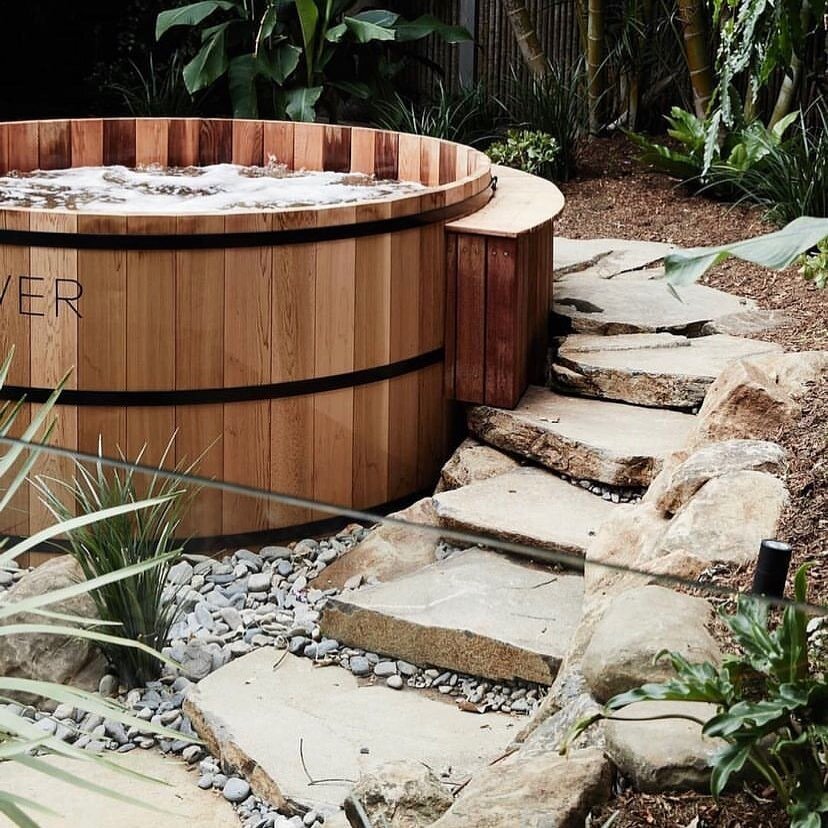 These rock steps blend seamlessly into the natural landscape and help elevate the tranquility of this space at @thebower.byronbay 
.
.
.
#spa #stonework #garden #homeinspo #byronbay #gardeninglife