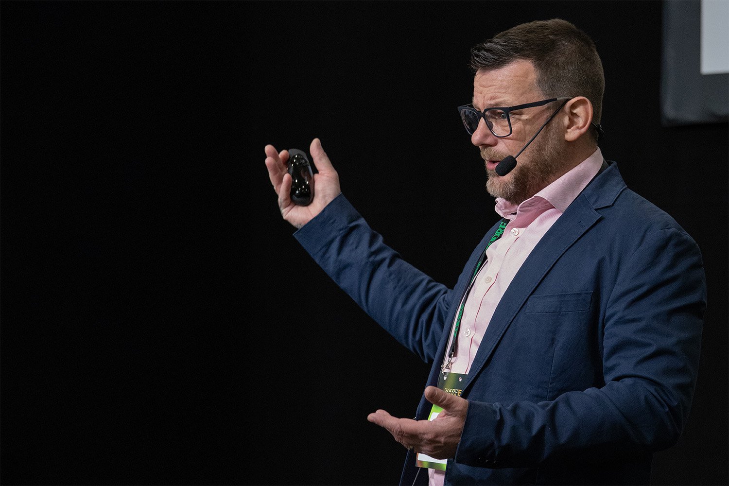 Tony Wigley presenting on stage at the ZOORF Expo, November 2025.