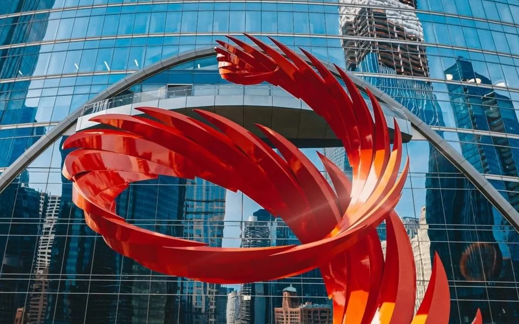 Modern sculpture and glass executive office building