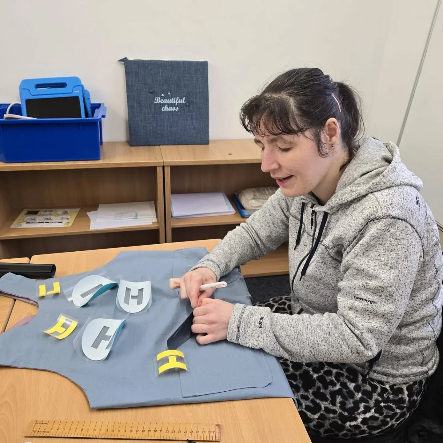 This is what we call a great collaboration! It all started with an idea for easy to put on and off Scrapstore aprons. They were designed and sewn by our talented customer with the Scrapstore fabric then branded by the Hub social enterprise team. Fina