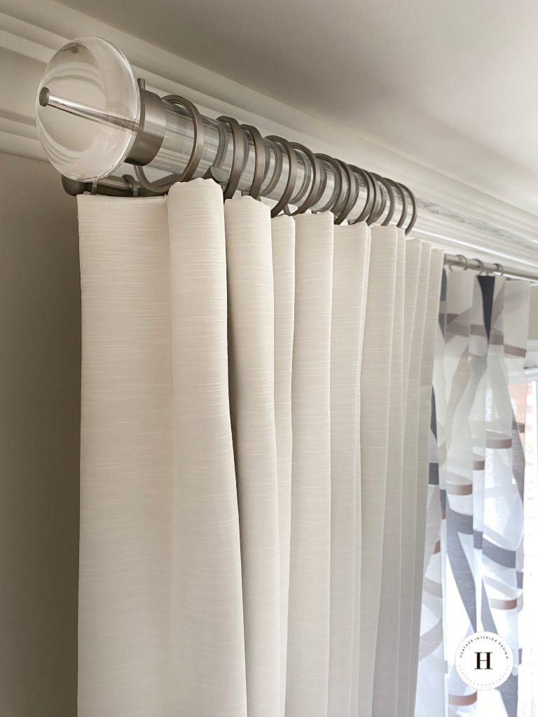 Modern chunky pole with neutral curtains and voile inner curtain