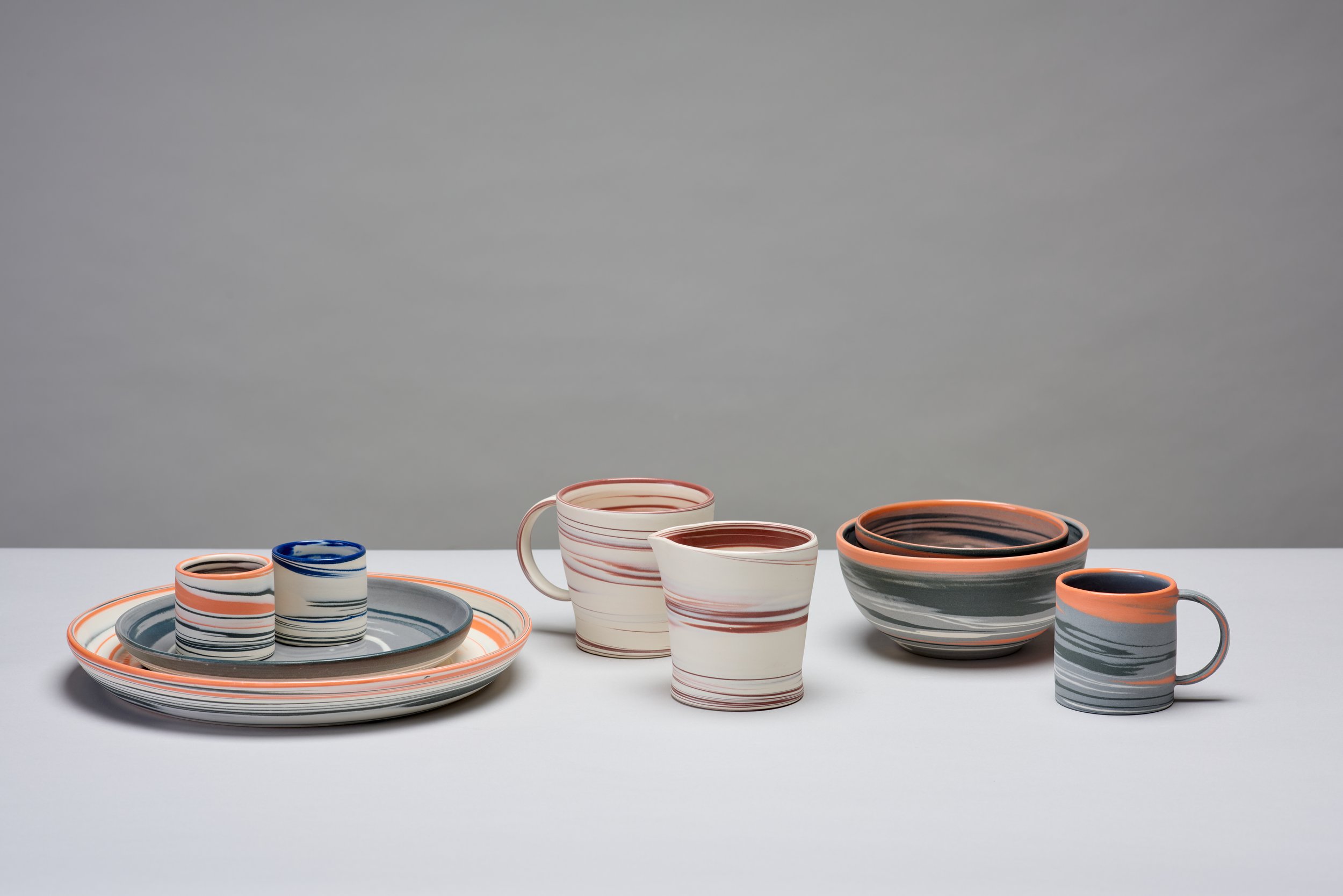 Hand thrown and turned functional agateware, mixed colours.
