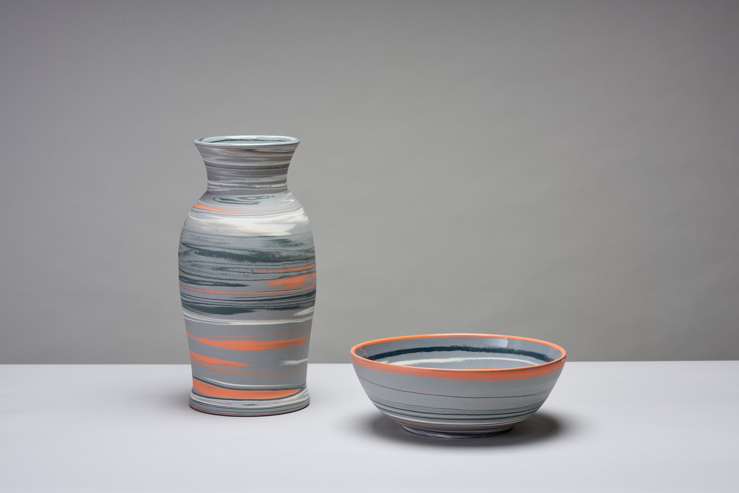 Grey, black, white, orange, thrown and turned agateware. Vase 32cm x 16cm. Bowl. 24cm x 9.5cm
