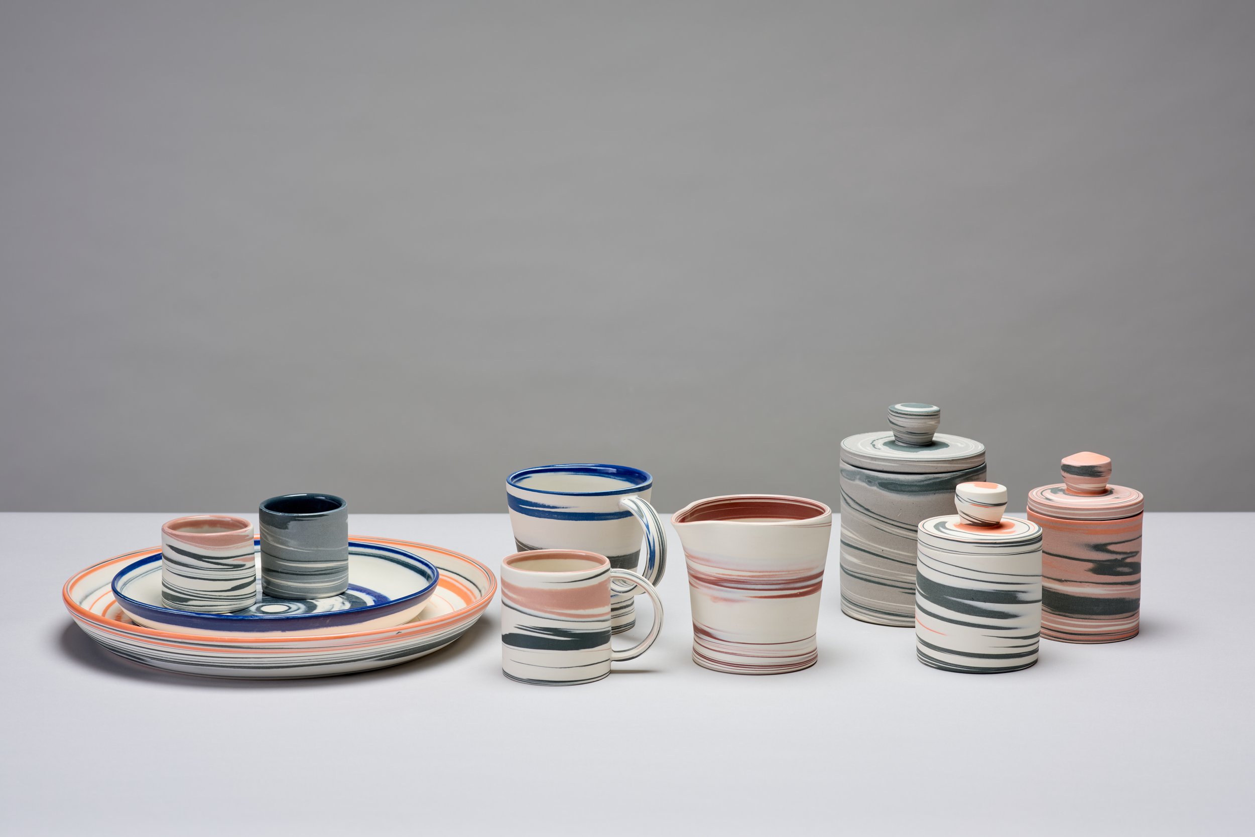 Hand thrown and turned functional agateware, mixed colours.